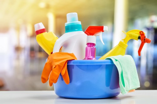 Cleaning technician applying safe carpet cleaning methods with protective measures